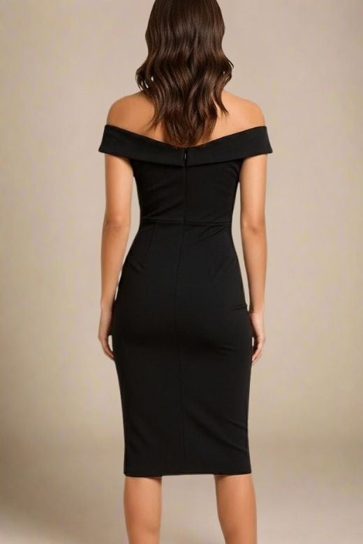 Woman wearing a figure flattering Ash Bandage Dress - Classic Black Bodycon Collection
