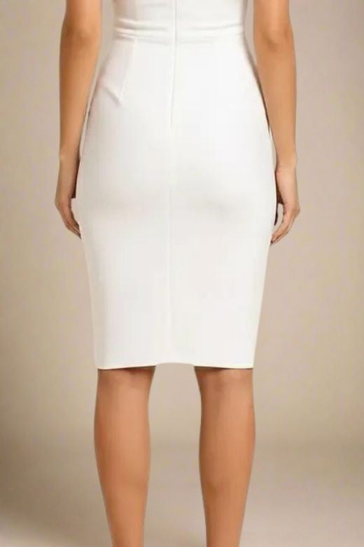 Woman wearing a figure flattering Bea Bandage Dress - White Pearl Bodycon Collection