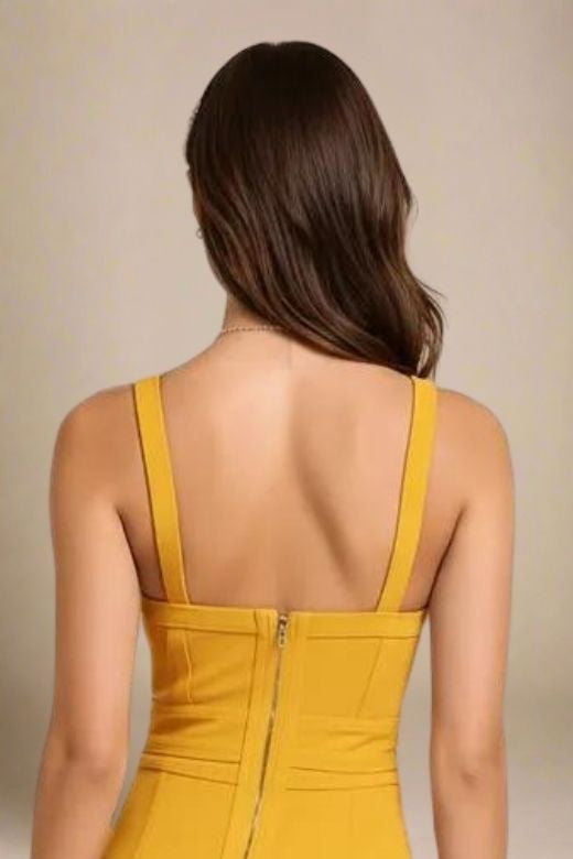 Woman wearing a figure flattering Bek Bandage Dress - Mustard Yellow Bodycon Collection