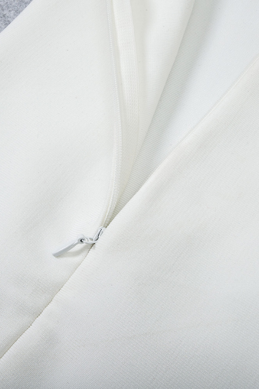 Woman wearing a figure flattering Blanche Bandage Midi Dress - White Pearl BODYCON COLLECTION