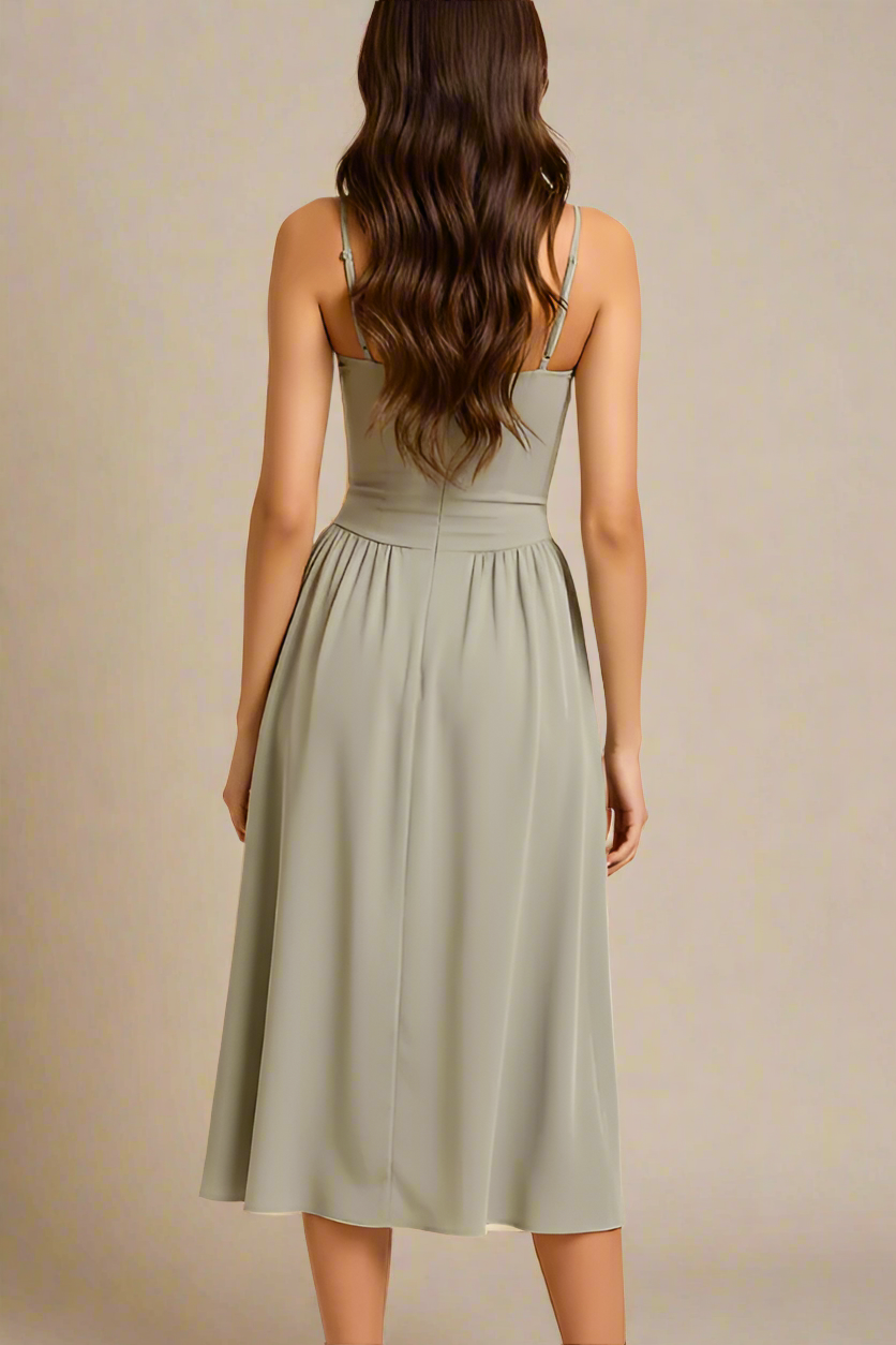 Woman wearing a figure flattering Everly Midi Dress - Sage Green BODYCON COLLECTION