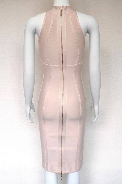 Woman wearing a figure flattering Lea Bandage Midi Dress - Beige Bodycon Collection