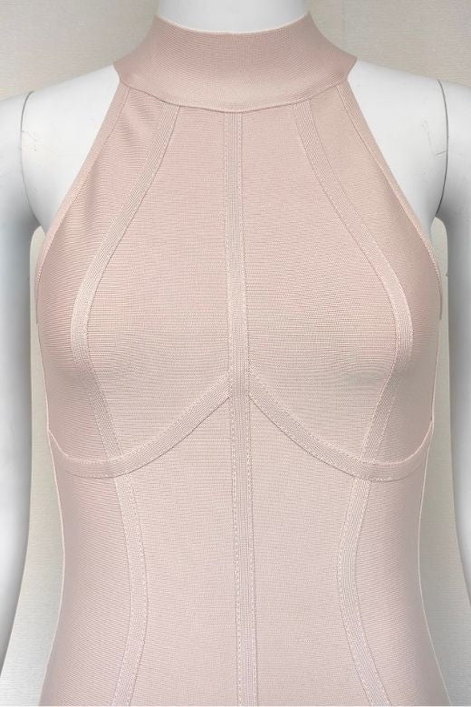 Woman wearing a figure flattering Lea Bandage Midi Dress - Beige Bodycon Collection