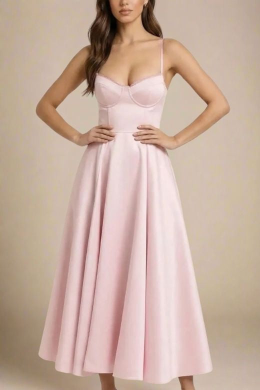 Woman wearing a figure flattering Mavis Midi Dress - Dusty Pink BODYCON COLLECTION