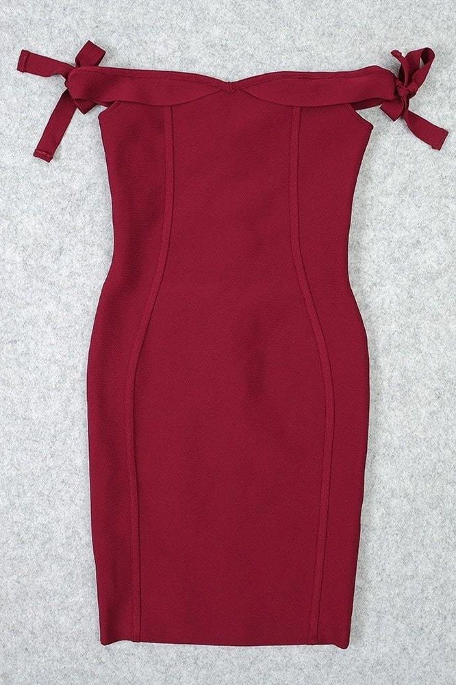 Woman wearing a figure flattering Penelope Bandage Mini Dress - Red Wine BODYCON COLLECTION