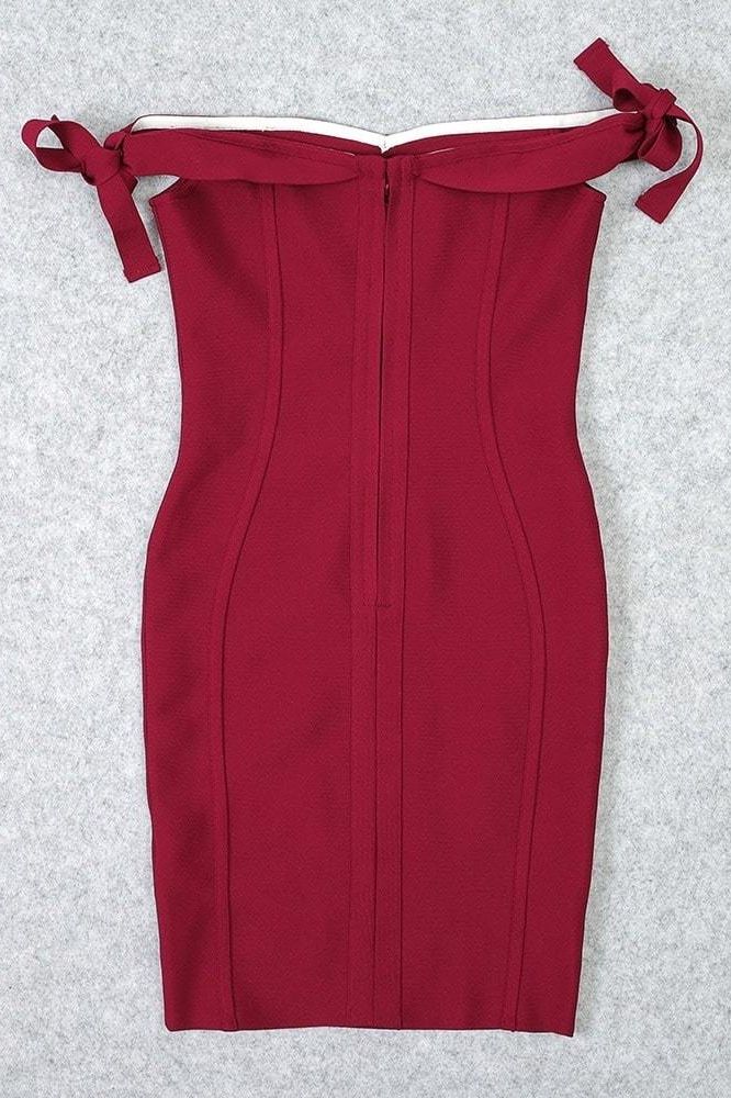 Woman wearing a figure flattering Penelope Bandage Mini Dress - Red Wine BODYCON COLLECTION