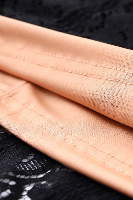 Woman wearing a figure flattering Rose Long Sleeve Bodycon Mini Dress - Classic Black BODYCON COLLECTION