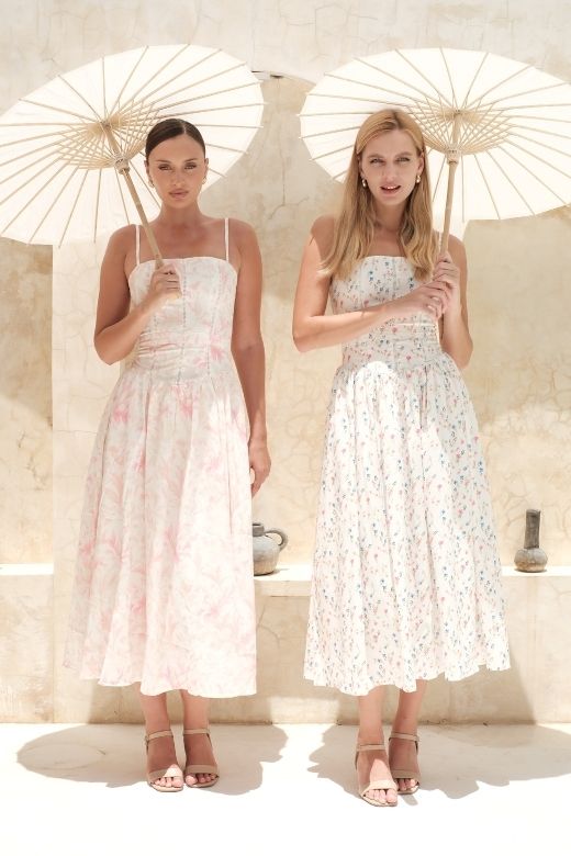 Woman wearing a figure flattering Tasmin Midi Dress - White Pearl BODYCON COLLECTION