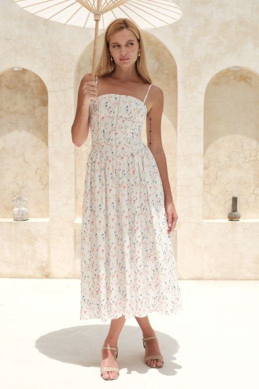 Woman wearing a figure flattering Tasmin Midi Dress - White Pearl BODYCON COLLECTION