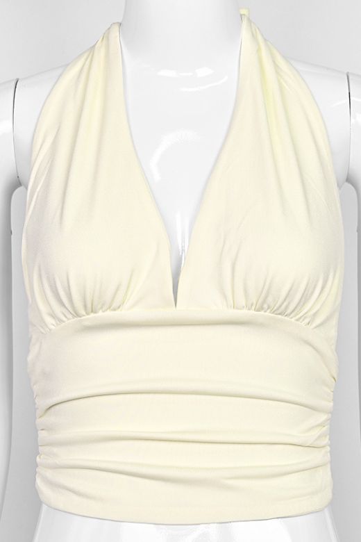 Woman wearing a figure flattering  Aby Halter Top - Butter Yellow BODYCON COLLECTION Pty Ltd