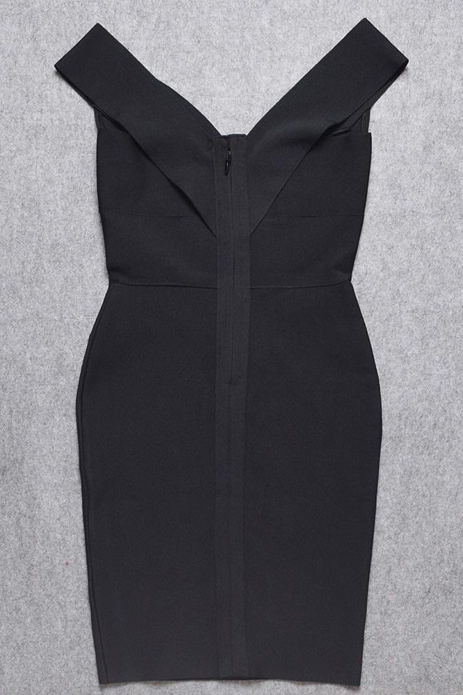 Woman wearing a figure flattering  Ash Bandage Dress - Classic Black Bodycon Collection