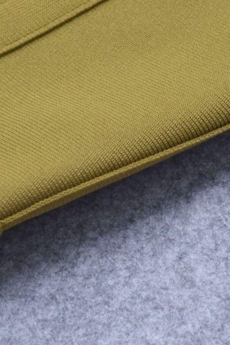 Woman wearing a figure flattering  Bek Bandage Dress - Olive Green Bodycon Collection