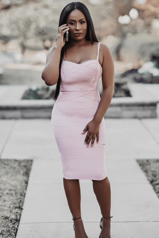 Woman wearing a figure flattering  Heidi Bandage Midi Dress - Dusty Pink Bodycon Collection