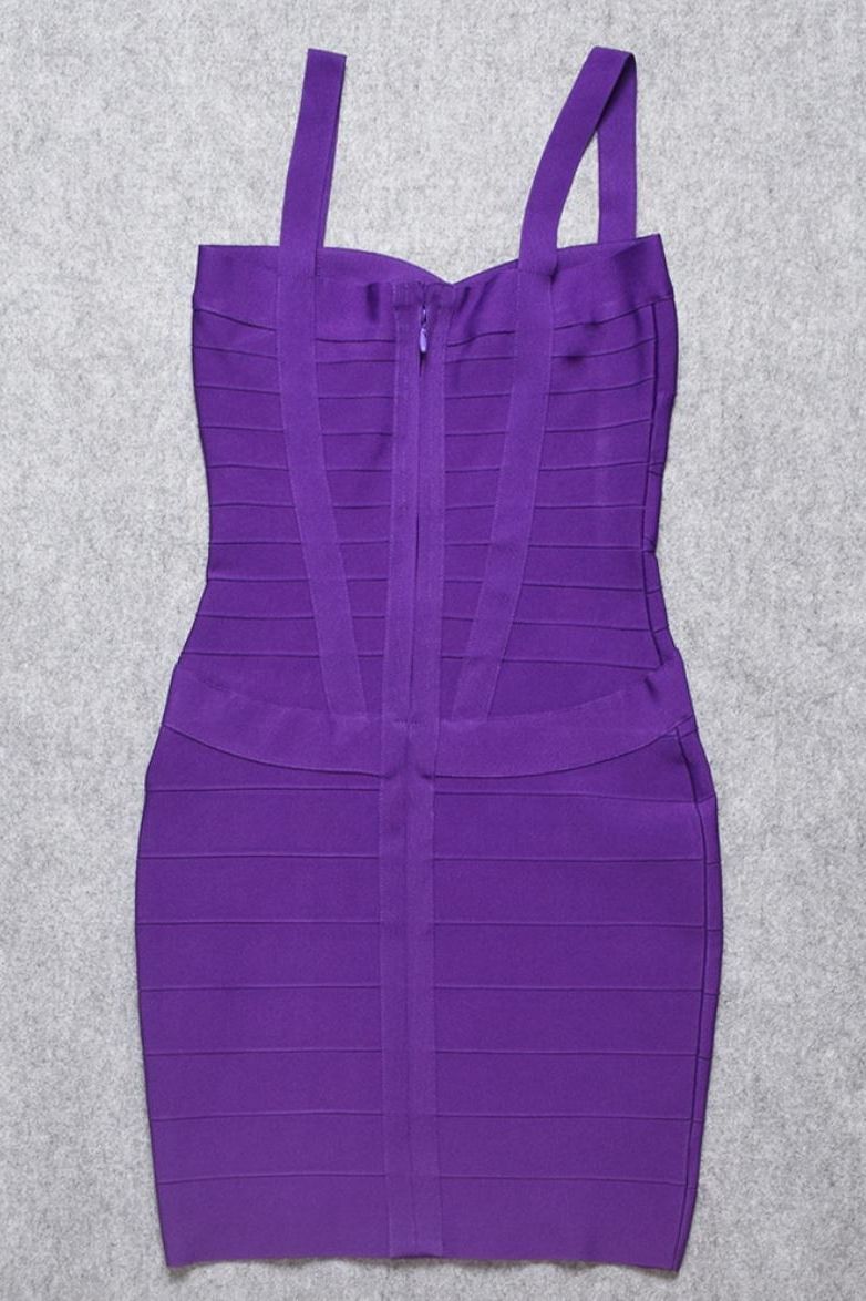 Woman wearing a figure flattering  Heidi Bandage Mini Dress - Plum Purple Bodycon Collection