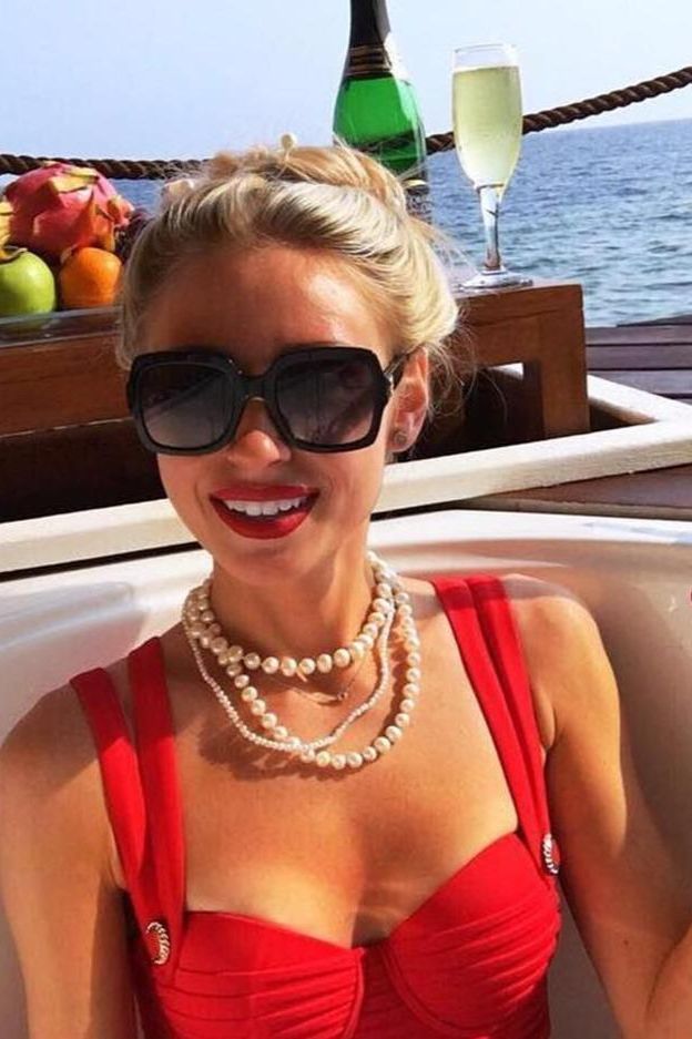 Woman wearing a figure flattering  Kate Bandage Dress - Lipstick Red Bodycon Collection