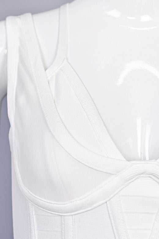 Woman wearing a figure flattering  Lucy Bandage Midi Dress - White Pearl BODYCON COLLECTION