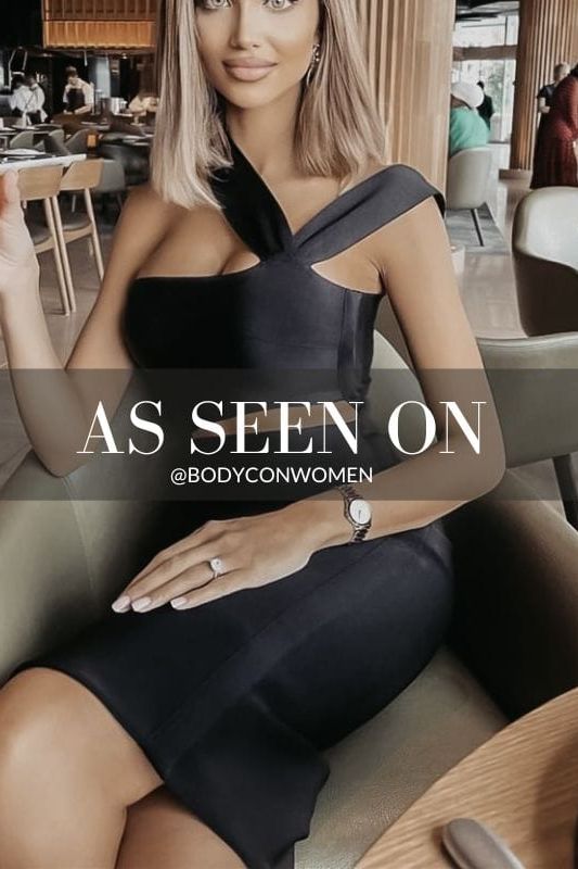 Woman wearing a figure flattering  Molly Bandage Midi Dress - Classic Black BODYCON COLLECTION