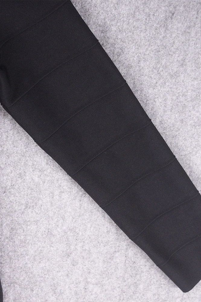 Woman wearing a figure flattering  Pamela Long Sleeve Bandage Mini Dress - Classic Black BODYCON COLLECTION