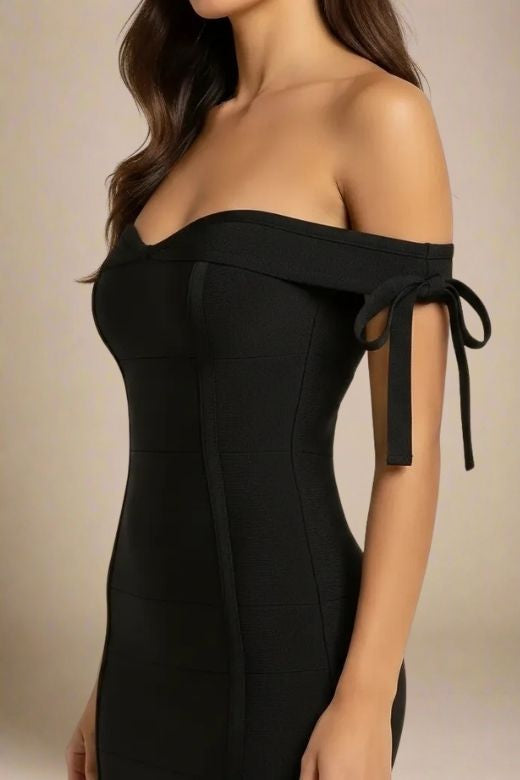 Woman wearing a figure flattering  Penelope Bandage Mini Dress - Classic Black BODYCON COLLECTION