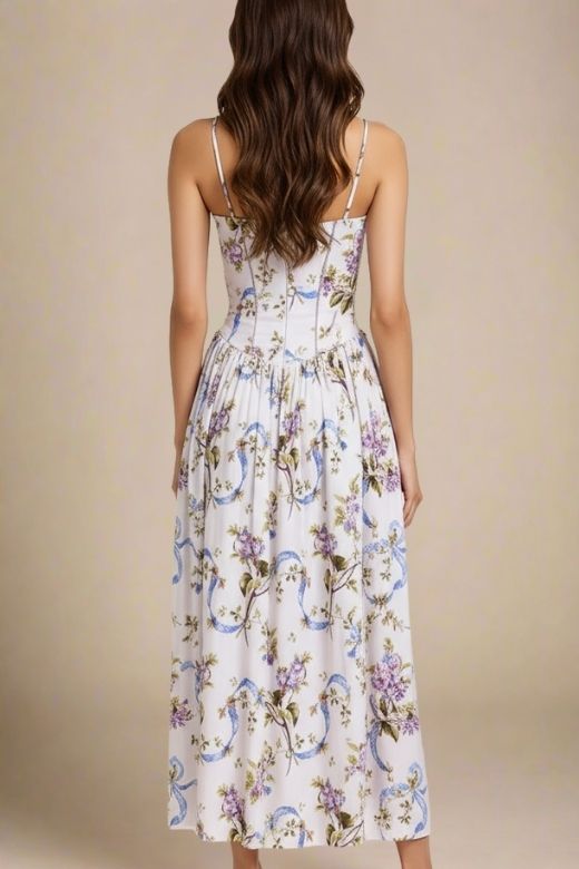 Woman wearing a figure flattering  Tasmin Midi Dress - White Floral BODYCON COLLECTION