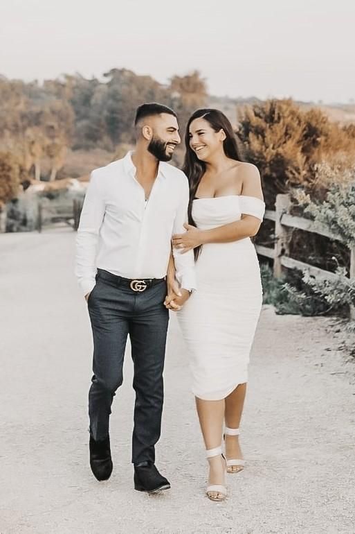 Woman wearing a figure flattering  Zia Bodycon Wrap Midi Dress - Violet Bodycon Collection